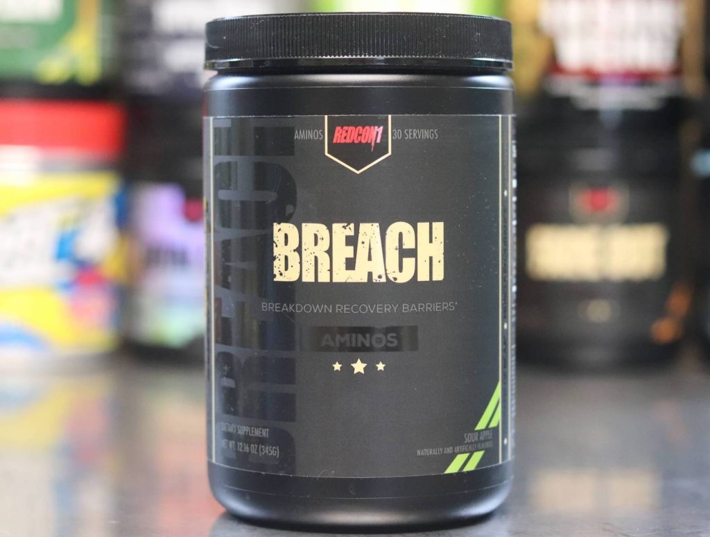 tall black tub of redcon1 breach aminos in sour apple flavor with black label