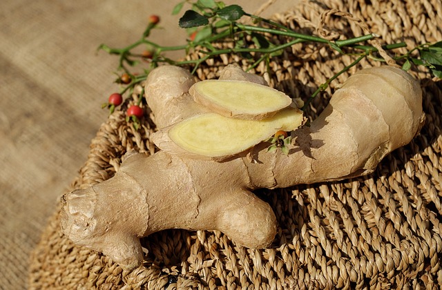 ginger root and two sliced pieces sitting atop woven basket under bright sunlight